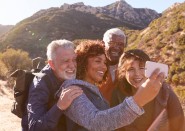 Group of older people taking a selfie on a hike